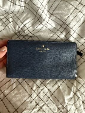 kate spade navy pebbled leather zip-around wallet with gold logo